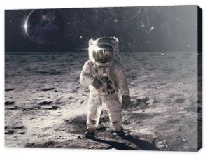 Astronaut on rock surface with space background. Elements of this image furnished by NASA