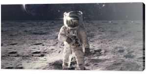 Astronaut on rock surface with space background. Elements of this image furnished by NASA